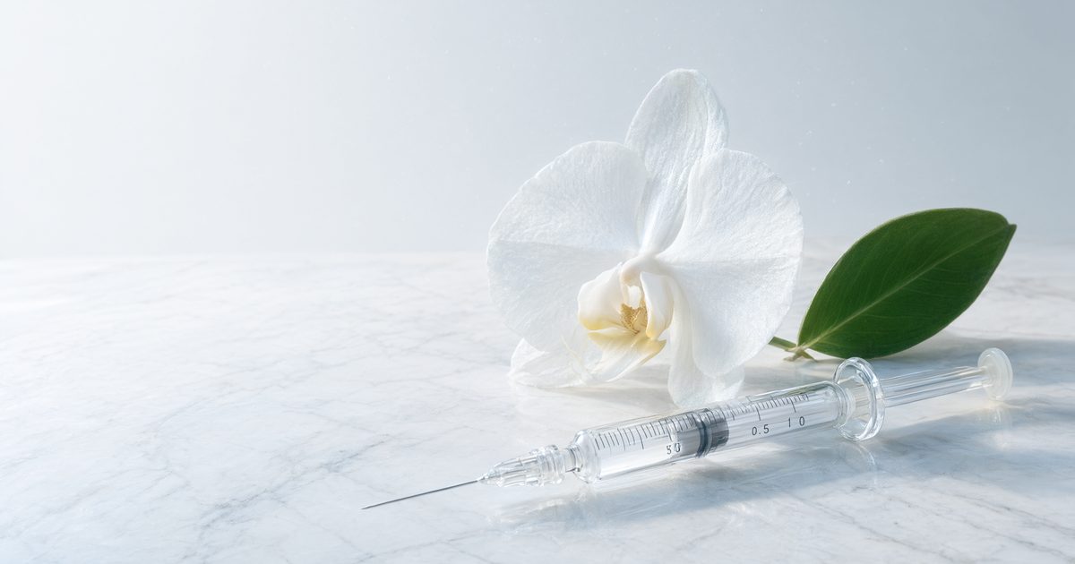 Conservative neuromodulator treatments in Phuket — orchid and glass syringe representing subtle natural Botox